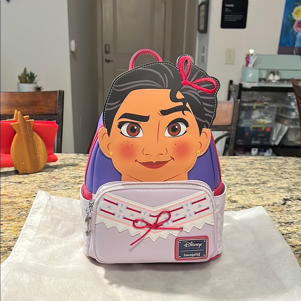 Loungefly Disney Backpack with Character Design.                          Encant